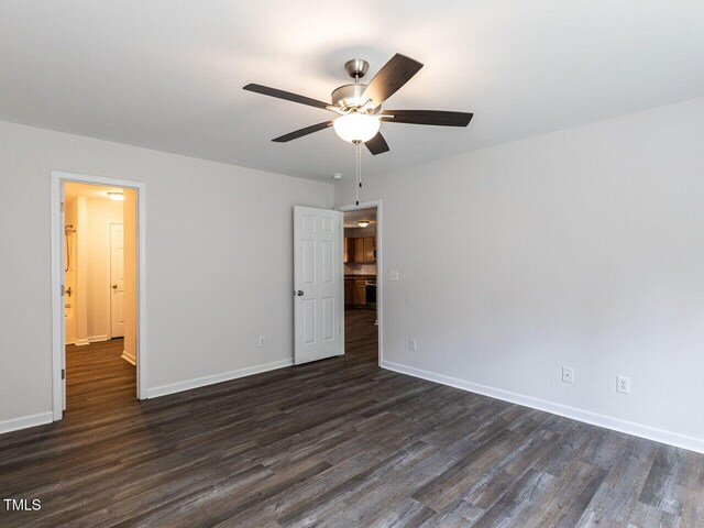 381 Gray Ghost Ln, Benson, NC 27504 - unfurnished bedroom with dark wood-style floors and ceiling fan