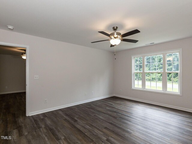 381 Gray Ghost Ln, Benson, NC 27504 - unfurnished room with a ceiling fan, dark wood finished floors, and a smoke detector