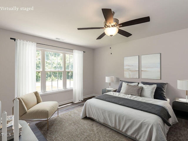 381 Gray Ghost Ln, Benson, NC 27504 - bedroom with wood finished floors and ceiling fan