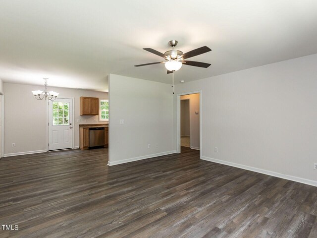 381 Gray Ghost Ln, Benson, NC 27504 - unfurnished living room featuring a chandelier, dark wood finished floors, and ceiling fan
