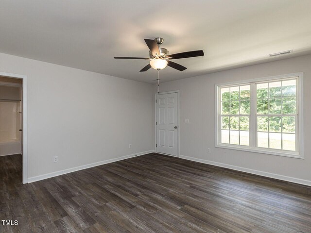 381 Gray Ghost Ln, Benson, NC 27504 - unfurnished room featuring dark wood-style floors and a ceiling fan