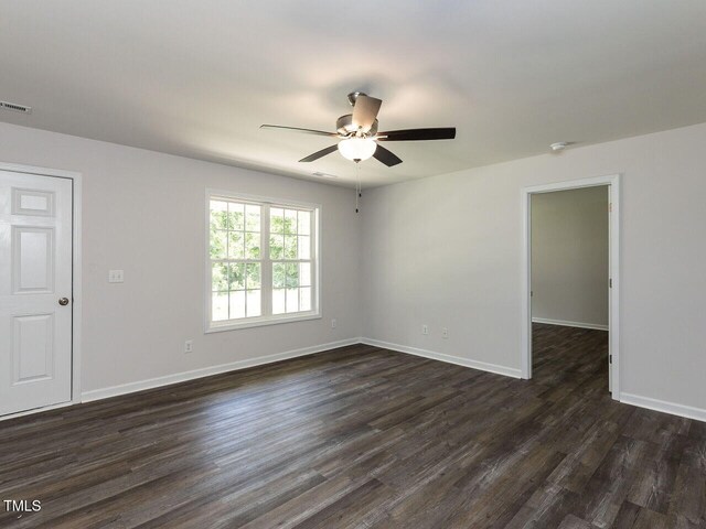381 Gray Ghost Ln, Benson, NC 27504 - spare room featuring dark wood-style flooring and ceiling fan