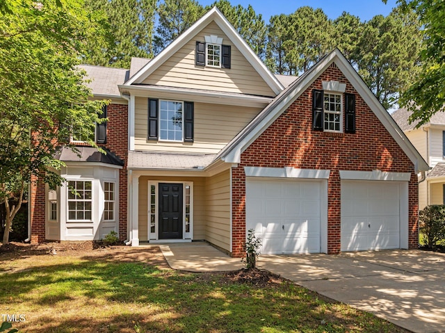 103 Burham Ct, Apex, NC 27502 - traditional home with driveway, brick siding, a garage, and a front yard
