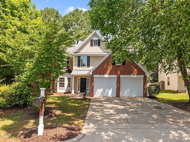 103 Burham Ct, Apex, NC 27502 - traditional-style house featuring brick siding, concrete driveway, and a garage