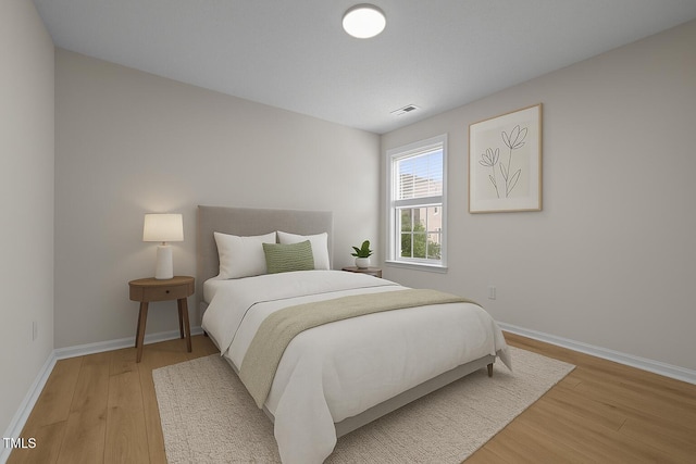 103 Burham Ct, Apex, NC 27502 - bedroom with light wood-style flooring and baseboards