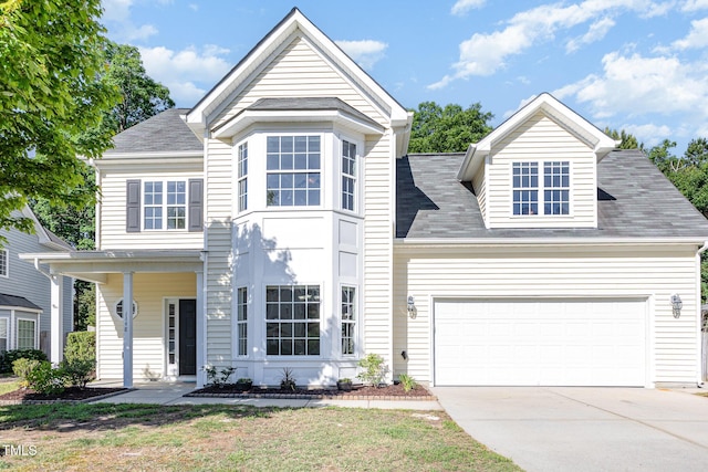 1148 Dexter Ridge Dr, Holly Springs, NC 27540 - view of front facade featuring driveway, a garage, and roof with shingles