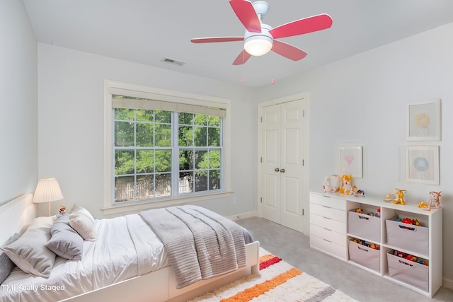 1148 Dexter Ridge Dr, Holly Springs, NC 27540 - carpeted bedroom with ceiling fan and a closet