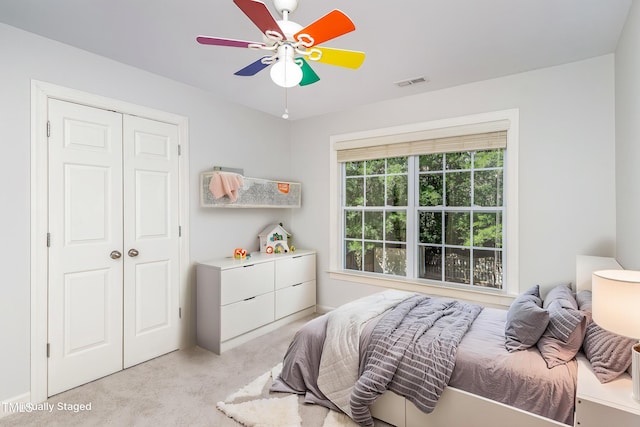 1148 Dexter Ridge Dr, Holly Springs, NC 27540 - bedroom with light colored carpet, a closet, and ceiling fan