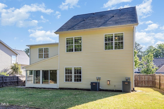 1148 Dexter Ridge Dr, Holly Springs, NC 27540 - rear view of property with a fenced backyard and a sunroom