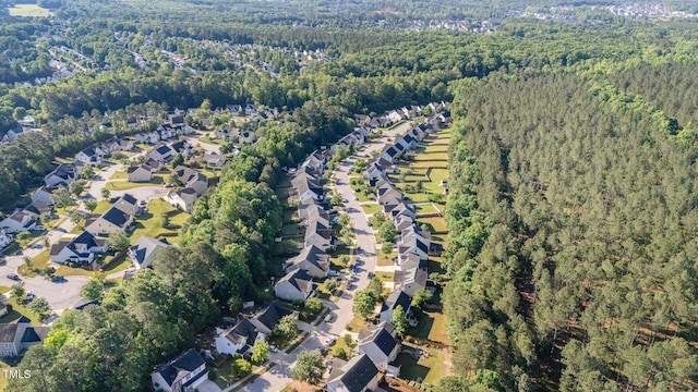 1148 Dexter Ridge Dr, Holly Springs, NC 27540 - view of property location featuring a forest and nearby suburban area