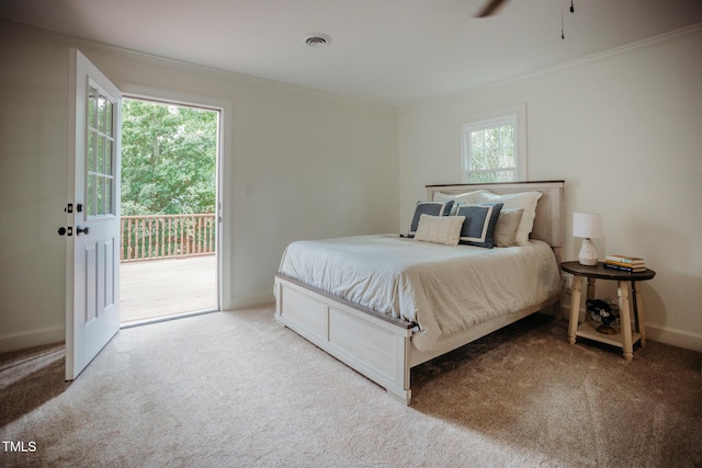 1702 Chamberlain Dr NW, Wilson, NC 27896 - bedroom featuring access to exterior, ornamental molding, and carpet flooring