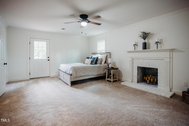 1702 Chamberlain Dr NW, Wilson, NC 27896 - bedroom featuring multiple windows, ornamental molding, carpet floors, a fireplace, and ceiling fan
