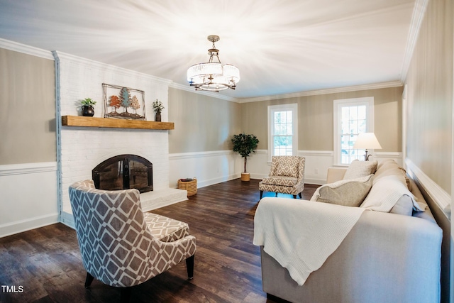 1702 Chamberlain Dr NW, Wilson, NC 27896 - living area with wood finished floors, ornamental molding, a brick fireplace, a chandelier, and wainscoting