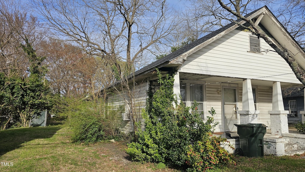 411 Fairview Ave SW, Wilson, NC 27893 - view of front of property with a porch and a front yard