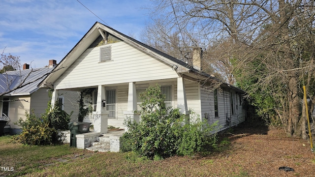 411 Fairview Ave SW, Wilson, NC 27893 - view of front of property featuring covered porch and a chimney