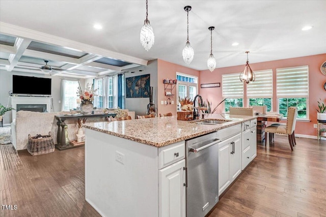 728 Opposition Way, Wake Forest, NC 27587 - kitchen featuring dishwasher, a ceiling fan, a kitchen island with sink, wood finished floors, and a fireplace