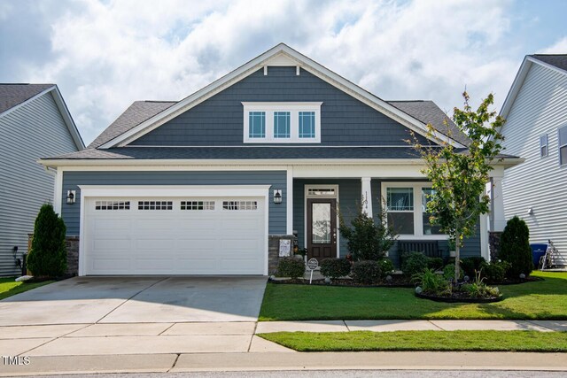 1104 Briar Gate Dr, Holly Springs, NC 27540 - craftsman-style home featuring driveway, a front yard, stone siding, and covered porch