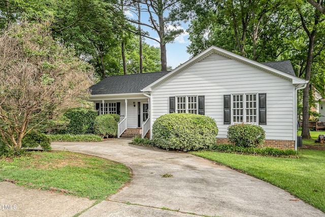 2629 Hiking Trl, Raleigh, NC 27615 - view of front of property with covered porch, roof with shingles, driveway, and a front yard
