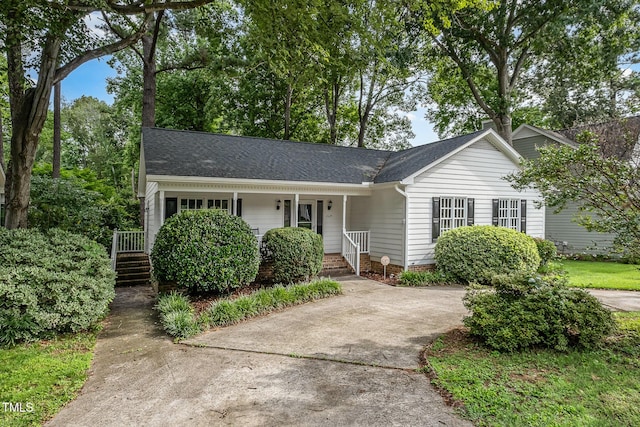 2629 Hiking Trl, Raleigh, NC 27615 - view of front of house featuring covered porch and a shingled roof