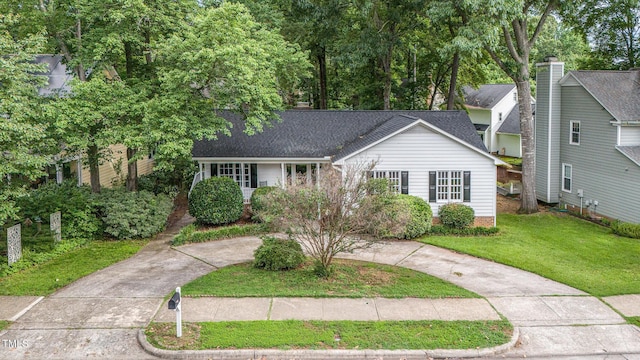 2629 Hiking Trl, Raleigh, NC 27615 - view of front of house featuring a front yard and a shingled roof