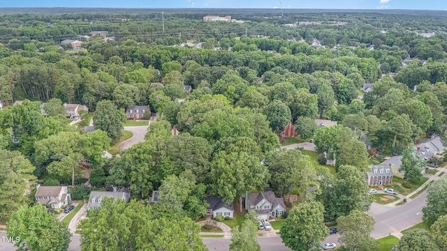 2629 Hiking Trl, Raleigh, NC 27615 - aerial view of property and surrounding area with a heavily wooded area