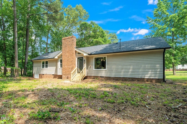 1308 Broken Branch Ct, Raleigh, NC 27610 - rear view of house with a chimney, crawl space, entry steps, and roof with shingles
