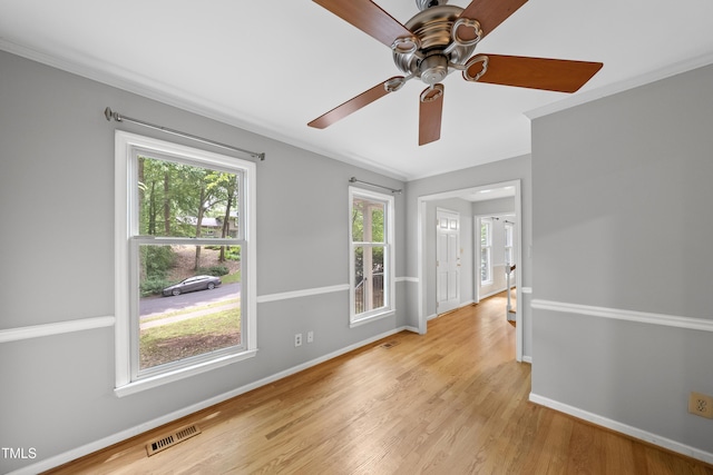 3517 Eden Croft Dr, Raleigh, NC 27612 - unfurnished room with crown molding, light wood-type flooring, and ceiling fan