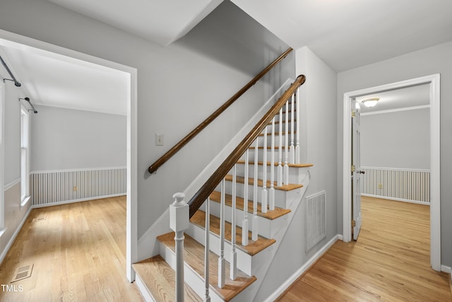 3517 Eden Croft Dr, Raleigh, NC 27612 - stairway featuring wood finished floors and radiator heating unit