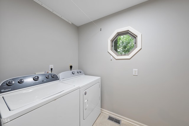 3517 Eden Croft Dr, Raleigh, NC 27612 - laundry room with independent washer and dryer and light tile patterned flooring