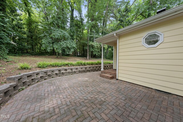 3517 Eden Croft Dr, Raleigh, NC 27612 - view of patio with view of wooded area