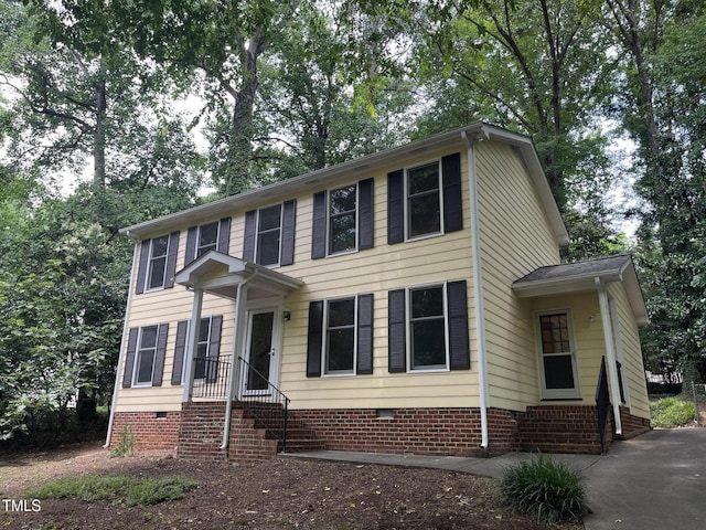 3517 Eden Croft Dr, Raleigh, NC 27612 - colonial home with crawl space, entry steps, and view of scattered trees