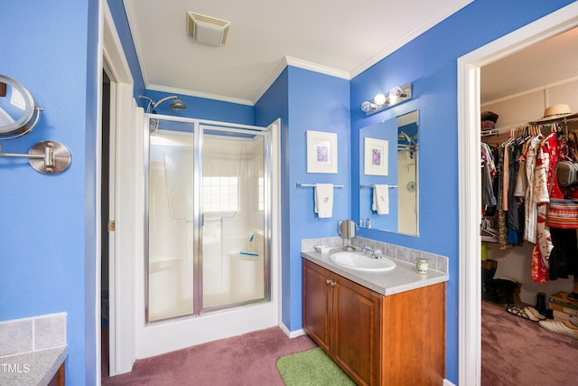 764 Olivers Grove Rd, Four Oaks, NC 27524 - bathroom featuring a shower stall, vanity, a walk in closet, and crown molding