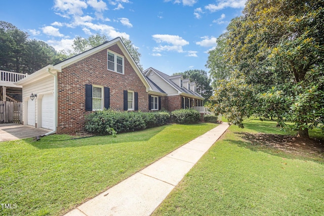 3913 Littlefield Ct, Raleigh, NC 27606 - view of front of home with brick siding, a front lawn, concrete driveway, and an attached garage