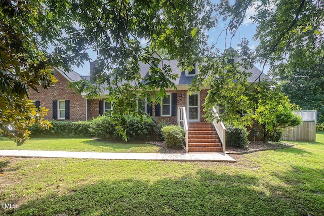 3913 Littlefield Ct, Raleigh, NC 27606 - view of front of home featuring brick siding, a front yard, and roof with shingles