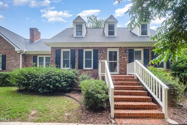 3913 Littlefield Ct, Raleigh, NC 27606 - cape cod house featuring brick siding and roof with shingles