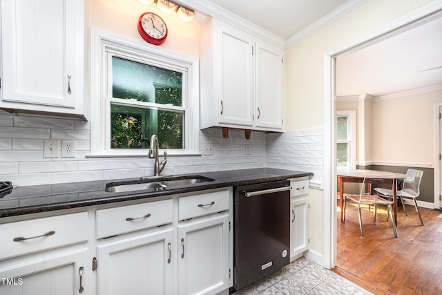 3913 Littlefield Ct, Raleigh, NC 27606 - kitchen featuring dishwashing machine, ornamental molding, white cabinetry, and dark stone countertops