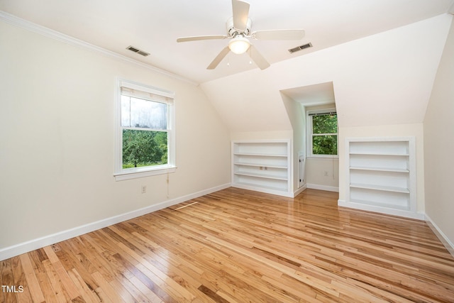 3913 Littlefield Ct, Raleigh, NC 27606 - bonus room with built in features, light wood-type flooring, vaulted ceiling, and ceiling fan