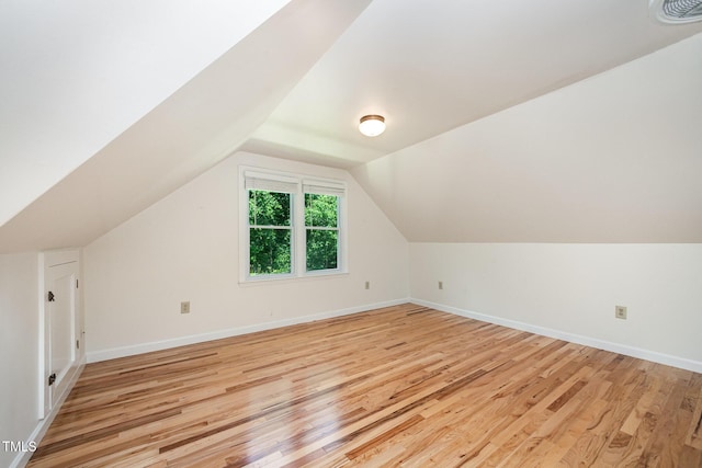 3913 Littlefield Ct, Raleigh, NC 27606 - additional living space with light wood-style flooring and lofted ceiling