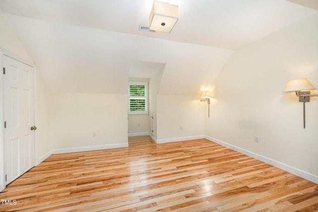 3913 Littlefield Ct, Raleigh, NC 27606 - empty room featuring lofted ceiling and light wood-style flooring
