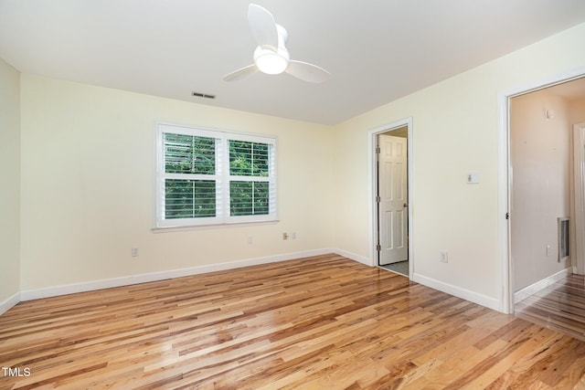 3913 Littlefield Ct, Raleigh, NC 27606 - empty room featuring light wood-type flooring and a ceiling fan
