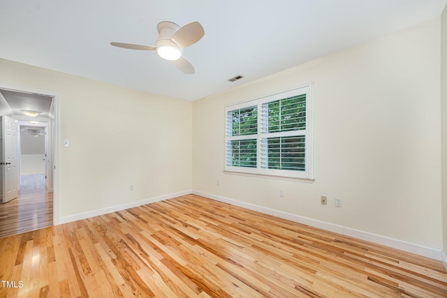 3913 Littlefield Ct, Raleigh, NC 27606 - empty room with light wood finished floors and a ceiling fan