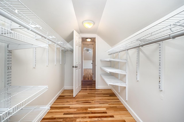 3913 Littlefield Ct, Raleigh, NC 27606 - spacious closet with light wood-type flooring and vaulted ceiling