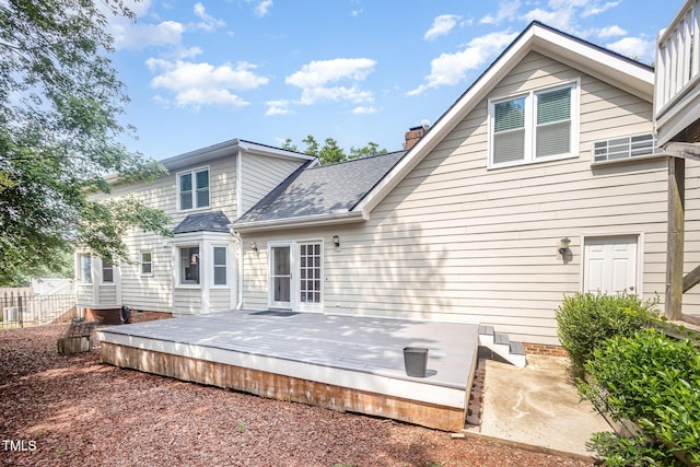 3913 Littlefield Ct, Raleigh, NC 27606 - back of house featuring a chimney, a shingled roof, and a wooden deck