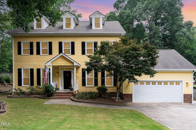 1001 Kingsway Dr, Apex, NC 27502 - colonial home featuring driveway, an attached garage, a front lawn, and a shingled roof