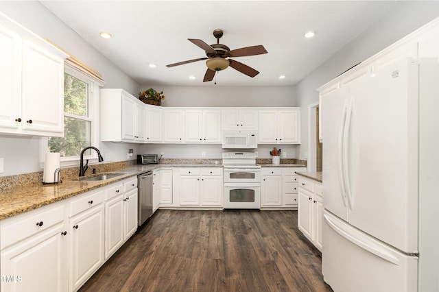 1001 Kingsway Dr, Apex, NC 27502 - kitchen with white appliances, dark wood finished floors, white cabinetry, a ceiling fan, and recessed lighting