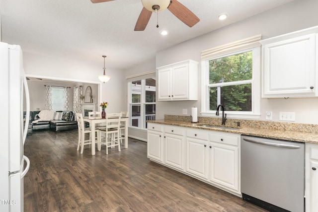 1001 Kingsway Dr, Apex, NC 27502 - kitchen with dishwasher, freestanding refrigerator, a ceiling fan, healthy amount of natural light, and recessed lighting