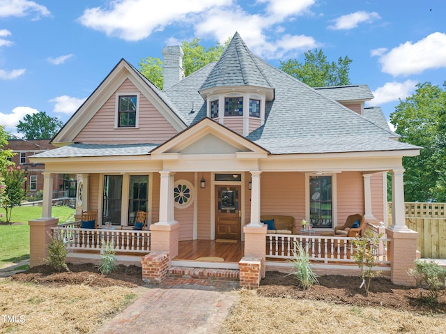 210 E Trinity Ave, Durham, NC 27701 - view of front of house featuring a porch, roof with shingles, and a chimney