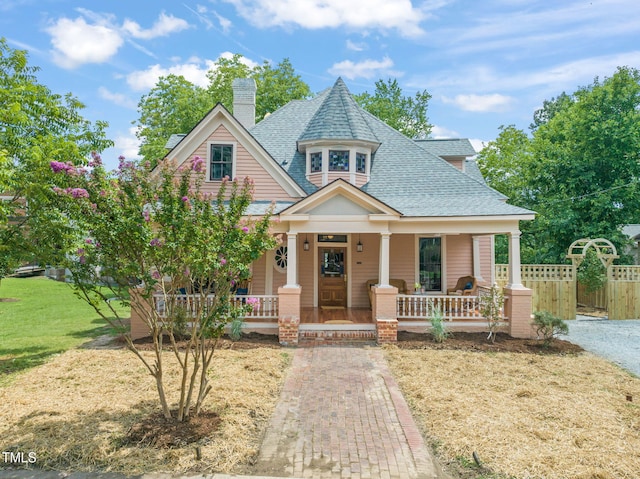 210 E Trinity Ave, Durham, NC 27701 - victorian house featuring covered porch, a shingled roof, and a chimney