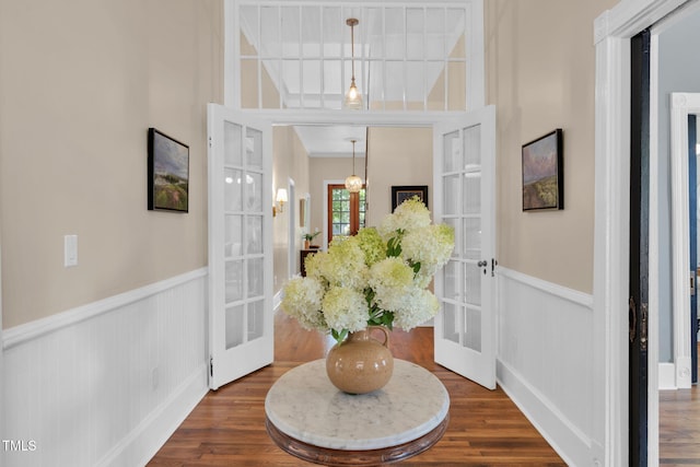210 E Trinity Ave, Durham, NC 27701 - entryway featuring french doors, wainscoting, and dark wood-style flooring