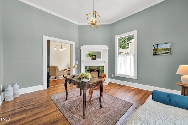 210 E Trinity Ave, Durham, NC 27701 - home office with a chandelier, wood finished floors, crown molding, and a fireplace with flush hearth